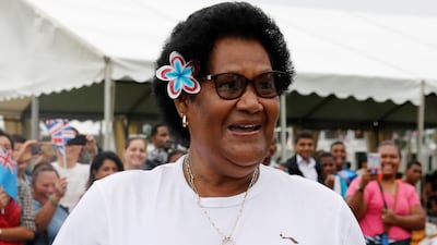 A well-wisher wears a t-shirt with an image of Britain's Prince Harry and Meghan.