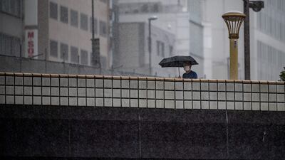 The approaching weather system brings heavy rain to Tokyo. AFP