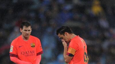 Lionel Messi and Xavi shown during their side's 0-0 draw with Getafe in La Liga on Saturday. Denis Doyle / Getty Images / December 13, 2014