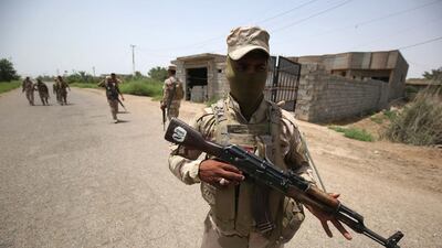 Iraqi soldiers patrol the streets of Saqlawiya village, which lies north-west of Fallujah, on June 8, 2016. Members of Shiite milita Ketaeb Hizbollah are alleged to have abducted the village's men on June 1. Ahmad Al Rubaye/AFP