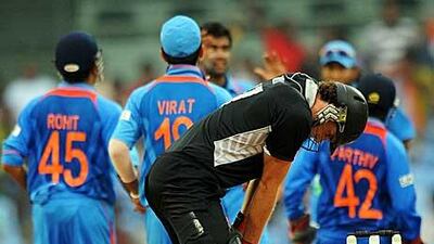 The Indians celebrate a dismissal as the Kiwis were bundled out for just 103.