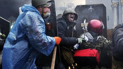 Protesters advance to new positions in Kiev on February 20, 2014. Top officials were evacuated from the main government building close to clashes in the heart of Ukrainian capital. Louisa Gouliamaki / AFP