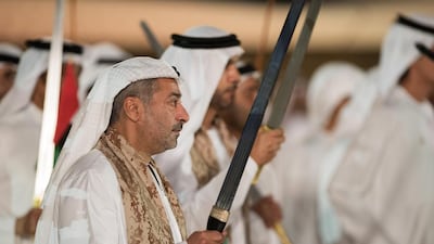 Sheikh Nahyan bin Hamdan bin Mohammed Al Nahyan, centre, dances during National Day celebrations at Adnec. Mohamed Al Suwaidi / Crown Prince Court - Abu Dhabi