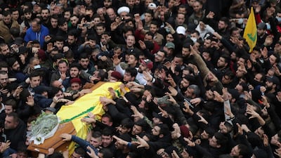 Mourners carry the coffin a Hezbollah fighter who was killed in Syria's northwestern Idlib region, during a funeral for him and four comrades, in the southern suburb of Beirut, Lebanon. AP Photo