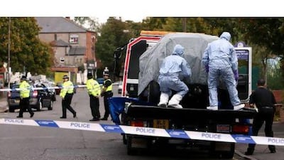 Police forensic science officers cover a car on a lowloader on Ladypool Road, near to Turner Street, Sparkbrook, Birmingham, after the arrest of six men in Birmingham as part of a large intelligence-led counter-terrorism operation.