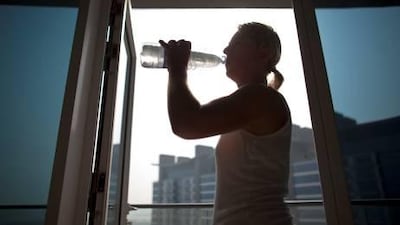Kerstin Jordan drinks from a water bottle at the Oceana Apartments on the Palm Jumeirah. Jordan says the Oceana apartments don't have any water now for 4 days. She says each month they don't have water for a few hours but this is the first time there has been no water for 4 days and all she has been given are 2 bottles of water.