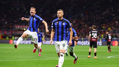 Nicolo Barella, left, celebrates with Edin Dzeko after Inter's opening goal. Getty