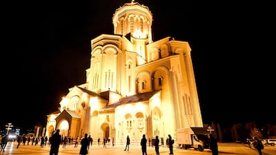 Georgian Orthodox believers, observing social distancing, attend the service on the eve of the Orthodox Easter in Tbilisi, as the country tries to curb the spread of the novel coronavirus. AFP