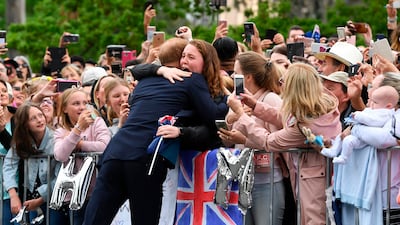 Britain's Prince Harry embraces a fan during a public walk in Melbourne in October 2018. AFP