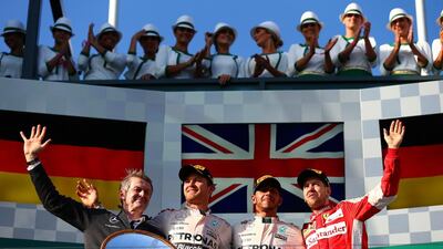 Thomas Weber, Nico Rosberg and Lewis Hamilton of Mercedes-GP, and Sebastian Vettel of Ferrari on the podium on Sunday after Hamilton's win in the Australian Grand Prix. Dan Istitene / Getty Images