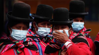 Aymara Indigenous women wait to enter the archaeological museum in Tiwanaku, Bolivia. AP Photo