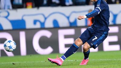 Real Madrid's Cristiano Ronaldo shoots and scores the opening goal on Wednesday night against Malmo in the Champions League. Jonathan Nackstrand / AFP