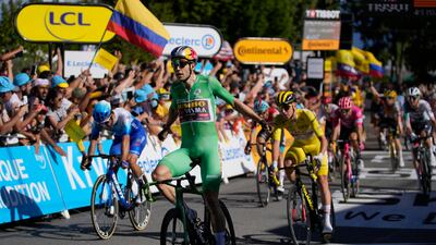 Stage winner Belgium's Wout Van Aert, wearing the best sprinter's green jersey, celebrates as he crosses the finish line ahead of second placed Australia's Michael Matthews, left and third placed Slovenia's Tadej Pogacar, wearing the overall leader's yellow jersey, during the eighth stage of the Tour de France cycling race over 186. 5 kilometers (115. 9 miles) with start in Dole, France, and finish in Lausanne, Switzerland, Saturday, July 9, 2022. (AP Photo / Thibault Camus)