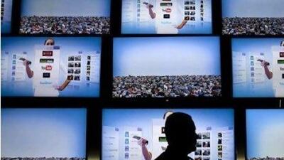 Telecoms companies are pushing for mega-convergence through platforms like internet content through web-based TV. Andrew Harrer / Bloomberg News