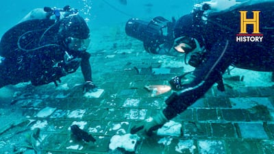 Underwater explorer and marine biologist Mike Barnette and wreck diver Jimmy Gadomski explore a segment of the 1986 Space Shuttle Challenger that they found off the coast of Florida. AP
