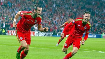 Gareth Bale begins to celebrate his goal, the eventual winner, against Belgium on Friday night in a 1-0 Euro 2016 qualifying victory. Geoff Caddick / EPA