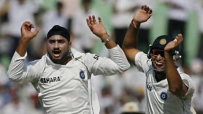Harbhajan Singh, left, celebrates the dismissal of Australia's Simon Katich on the fourth day of their second Test.