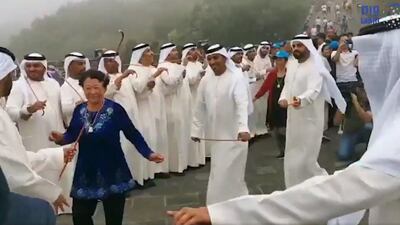 A UAE folklore group dances the ayala at the Great Wall of China. Wam