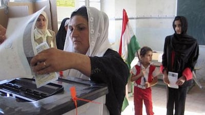Kurdish women vote in Iraq's constitutional referendum in the northern city of Kirkuk in October 2005.