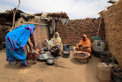 Fanna Hamit, 58, a Chadian widow, is hosting in her compound a family of 11 Sudanese who fled the violence in their country's Darfur region. Reuters