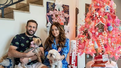 The Watson family: Ben and Cherry pose with their two dogs and their candy cane tree with handmade ornaments. All photos by Antonie Robertson / The National