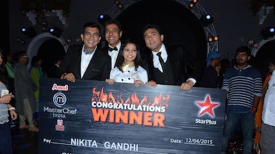 Nikita Gandhi, centre, the winner of MasterChef India 4, poses with, from left, judges Sanjeev Kapoor, Ranveer Brar and Vikas Khanna. Jayesh Pandya / IANS