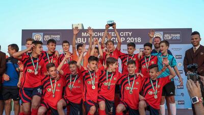 CS Luceafarul from Romania celebrate after becoming the U-14 champions at the Manchester City Abu Dhabi Cup. Victor Besa / The National