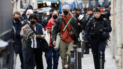 Protesters in support of Palestinians in Gaza are escorted away by police forces during the evacuation of the Sciences Po University, amid the ongoing conflict between Israel and the Palestinian Islamist group Hamas, in Paris, France, May 3, 2024. REUTERS / Benoit Tessier