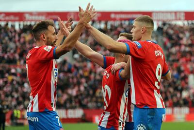 Cristhian Stuani, left, scored both goals in Girona's 2-1 win against Valencia. AFP