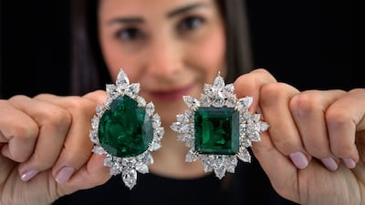 Left: an emerald and diamond brooch/pendant combination, Harry Winston, circa 1970, set with a pear-shaped emerald weighing 104.40 carats, and right: an emerald and diamond brooch/pendant combination Harry Winston, set with a step-cut emerald weighing 80.45 carats. AFP