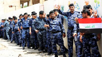 Members of the Iraqi security forces wait to cast their early votes in the Iraq election in Baghdad. Ali Abbas / EPA