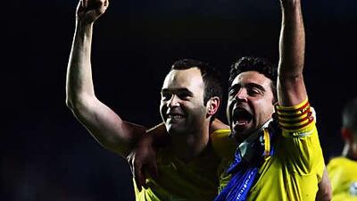 Andres Iniesta, left, and Xavi pull the strings in midfield for both club and country.