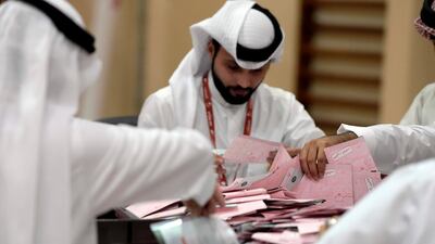 Bahraini election officials count ballots after a runoff vote in parliamentary and municipal elections on December 1, 2018. AFP