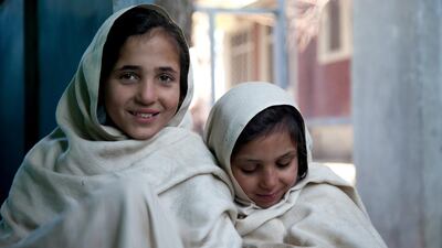 Asma (right), 8, with her sister Shabnam, 6. This is Khan's favourite photograph from the collection. Sa’adia Khan / MSF