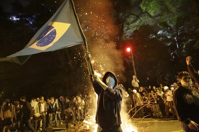 People protesting against the government in Brazil last year. Nelson Antoine / AP Photo