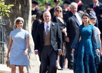 Prince Andrew, Duke of York, with daughters Princess Eugenie and Princess Beatrice at the wedding of the Duke and Duchess of Sussex. Reuters