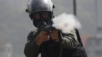 A member of the security forces fires tear gas during clashes at a protest against Venezuelan President Nicolas Maduro's government in Caracas, Venezuela. Reuters / Carlos Garcia Rawlins