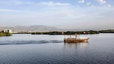 A dhow sails on Ras Al Khaimah’s corniche. Reem Mohammed / The National