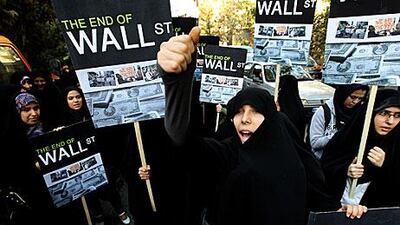 Iranian women show support for the Occupy Wall Street movement outside the Swiss Embassy in Tehran in October.
