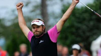 Jose Manuel Lara celebrates after sinking a putt on the 18th hole during the final round of the Austrian Open.