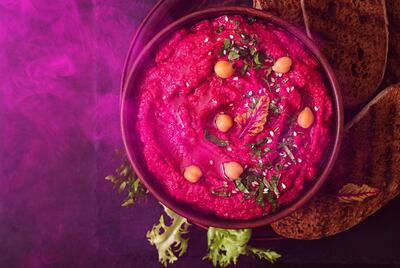 Prepare roasted beet hummus at Atayeb. Courtesy Yas Viceroy Hotel