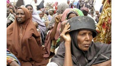 Somalis displaced by famine wait to receive rations at a displaced camp in Mogadishu, Somalia yesterday. Mohamed Sheikh Nor / AP Photo
