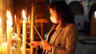 Christian pilgrims light candles at the Nativity Church, the traditional birthplace of Jesus in the West Bank city of Bethlehem. EPA
