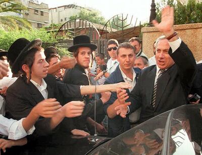 Israeli right-wing Likud party leader "Bibi" Netanyahu meets ultra orthodox students of a religious school in Benibrak, a religious town near Tel Aviv, in May 1996. AFP
