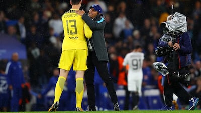 Thibaut Courtois and Antonio Conte celebrate Chelsea's 6-0 win over Qarabag in the Uefa Champions League on Tuesday night. Clive Rose / Getty Images