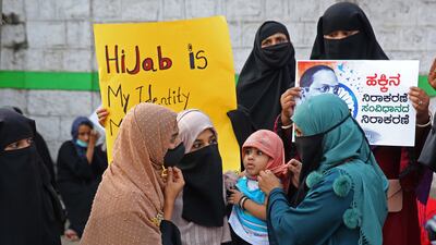 The women have received the backing of several organisations, while the colleges' stance has won the support of the state's ruling Bharatiya Janata Party. EPA