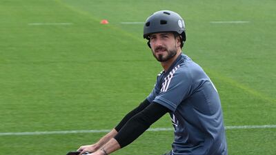 Germany goalkeeper Kevin Trapp arrives on a bicycle . AFP