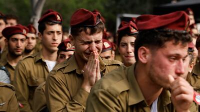 Israeli soldiers mourn Sgt David Sassoon at a funeral in Netanya. Sgt Sassoon was one of more than 245 Israeli troops killed in the Gaza war. Getty Images