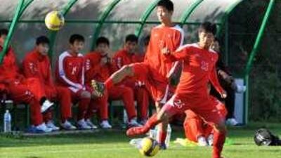 North Korean footballers practise in France last October. The team has shifted its upcoming camp in Zimbabwe to the capital, Harare.