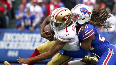 San Francisco 49ers quarterback Colin Kaepernick is tackled by Buffalo Bills cornerback Stephon Gilmore on Sunday, Oct. 16, 2016, in Orchard Park, New York. Jeffrey T. Barnes / AP